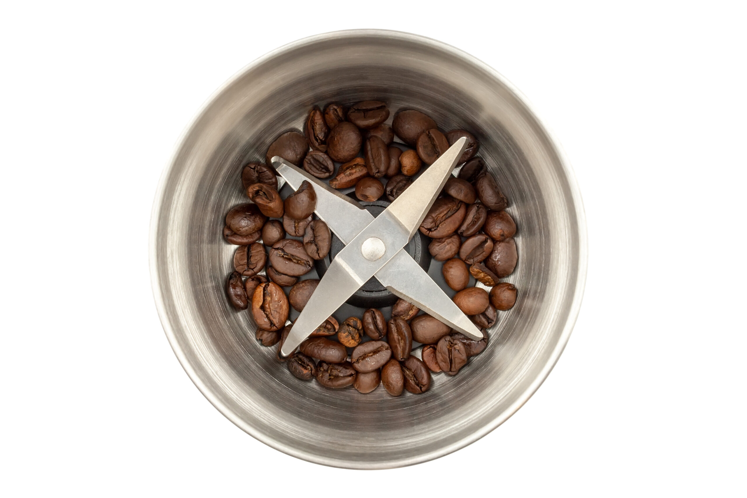 Coffee beans in a blade grinder.