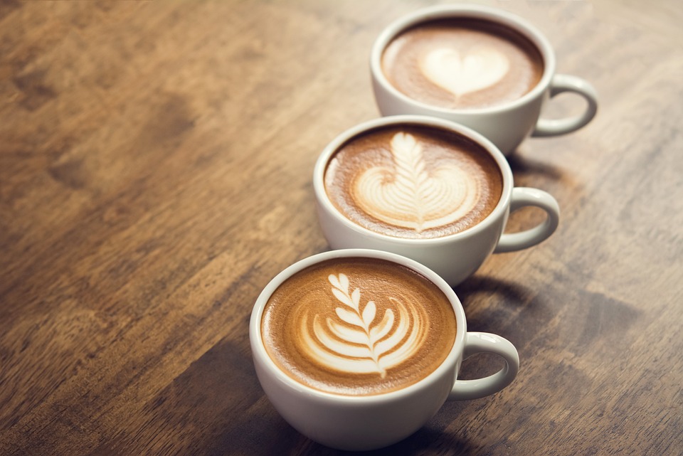 three-cups-of-espresso-with-crema Three mugs of espresso with a layer of crema and latte art.